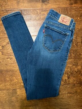 Levi's Women's 710 Super Skinny Jeans in Medium Blue Denim with Red Tab